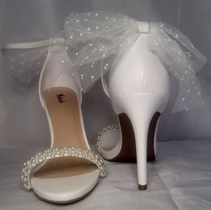 White stilettos heeled sandals, faux pearls, beautiful bow on the back